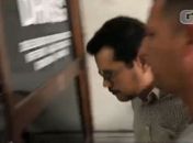 Flávio dos Santos chegando na Delegacia de Homicídios.