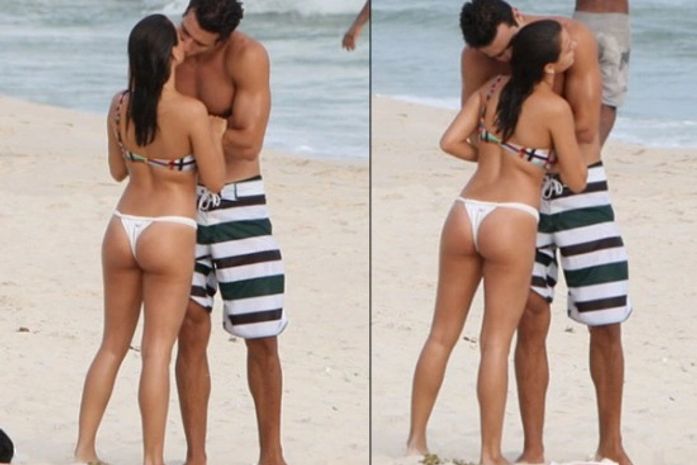 Fotos: Isis Valverde troca beijos com suposto namorado na praia