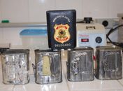 Latas com pasta-base de cocaína foram aprendidas pela PF 