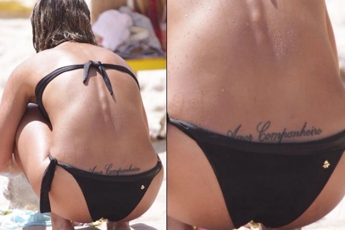 Camila Rodrigues deixa tattoo à mostra em dia de praia