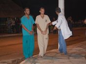 Acusados durante a reconstituição do crime