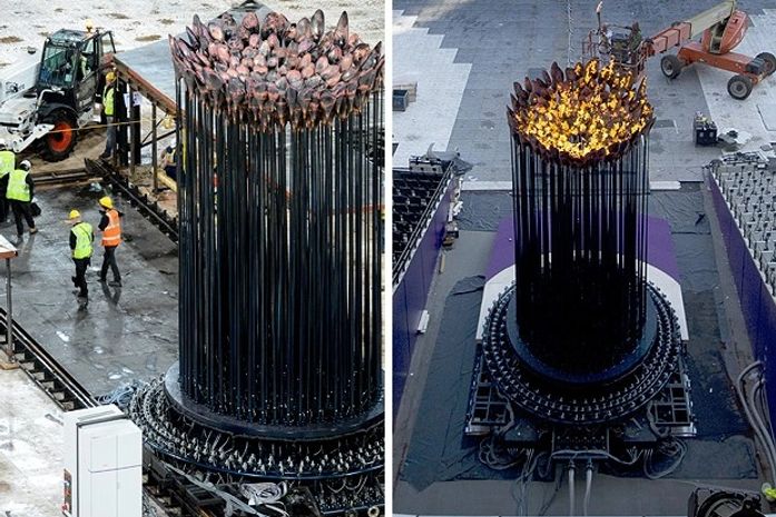 Pira olímpica é apagada para mudança de local e é acesa novamente no Estádio Olímpico (Foto: AFP)