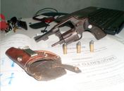 Arma apreendida com o acusado