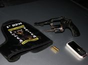 Arma apreendida com o acusado 