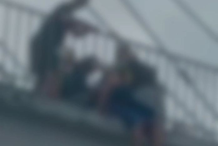 Bombeiro militar salva mulher que ameaçava pular de passarela em Maceió