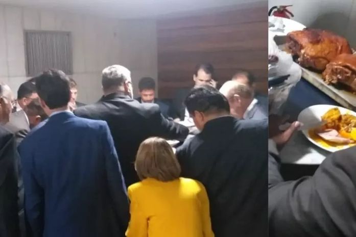 Deputado é aplaudido de pé e gera tumulto após chegar à Câmara com leitões assados