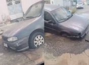 Carro tem frente ‘engolida’ por asfalto após vazamento na Pajuçara, em Maceió