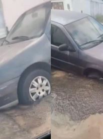 Carro tem frente ‘engolida’ por asfalto após vazamento na Pajuçara, em Maceió