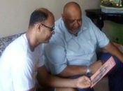 Padre Luciano (óculos) apresentando programação ao  assessor de comunicação Pedro Soares (Pedão)