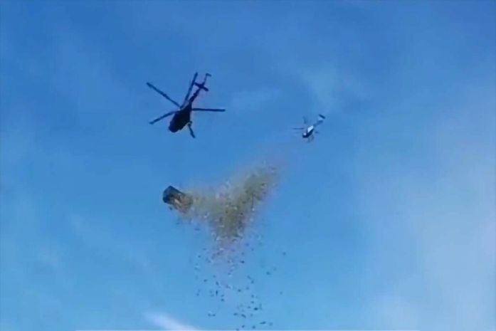 "Chuva de dinheiro": de helicóptero, bilionário despeja 5 milhões de reais em pessoas