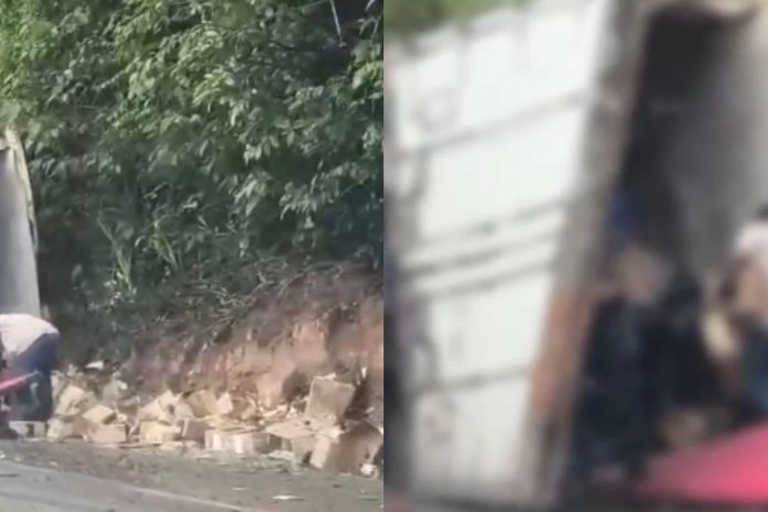 Vídeo: caminhão carregado de queijos tomba na BR-101 e carga é saqueada por populares