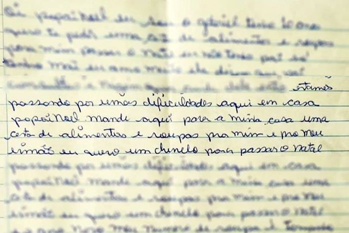 Criança escreve carta pedindo comida ao Papai Noel.